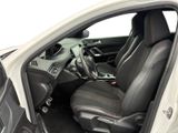 the interior of a white car with black leather seats and a steering wheel
