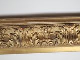 an image of a gold frame with a decorative design on it