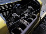 a close up view of a car engine with the hood open