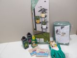 a box of gardening supplies sitting on a table next to a pair of gardening gloves