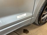 a close up of a car ' s bumper with a sticker on it