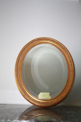 a mirror sitting on top of a marble counter