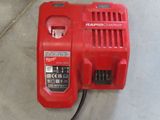 an image of a red power tool on the ground