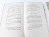 two open books sitting on a table next to each other