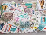 a bag full of postage stamps sitting on a table