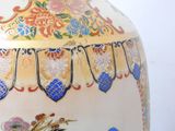 a large vase with a floral design on it