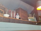 a shelf with various items on it in a room