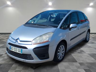 the silver citrole is parked on a checkered tile floor
