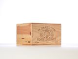 a wooden box with a label on it on a table
