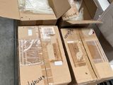 several boxes of assorted items sit on a pallet in a warehouse