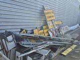 a pile of junk on the ground next to a building