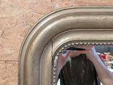 a person taking a picture of themselves in a mirror