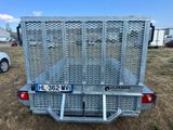 a picture of a trailer with a cage on the back of it