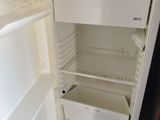 an open refrigerator with a lot of food inside of it