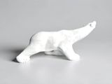 white ceramic polar bear figurine on a gray background