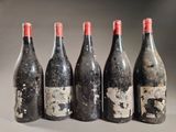 six bottles of wine are lined up in a row
