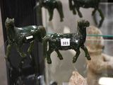 a glass display case with a lot of figurines of animals