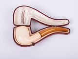 an image of a pipe holder with a pipe inside of it