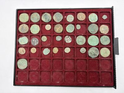 a red box with a lot of coins in it