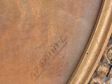 an image of a close up of a gold frame on a table