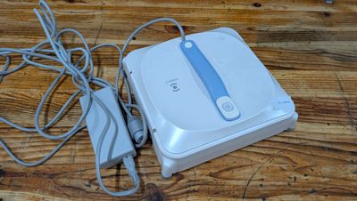 a wii game system sitting on a wooden table