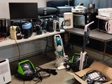 a room with a lot of appliances and appliances on the floor