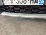 a close up of the front of a car with a number plate on it
