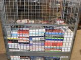 a metal cart with many books on it in a warehouse