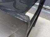 a metal bench that is sitting in the middle of a room