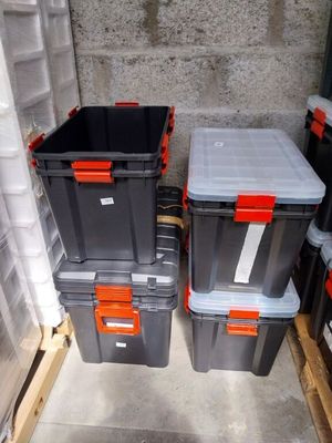 many plastic containers that are stacked on top of each other