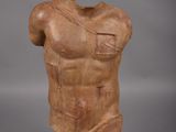 an image of a statue of a male torso on a white base