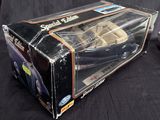 a box with a toy car in it on a table