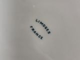 a close up of a white plate with black writing on it