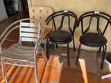 three chairs that are sitting on the floor outside