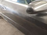 a close up of a car door with a mirror on it