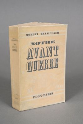 an old book sitting on top of a table on a gray surface