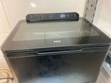 an image of a microwave with a digital clock on top of it