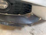 a close up of a car ' s front bumper with a light on