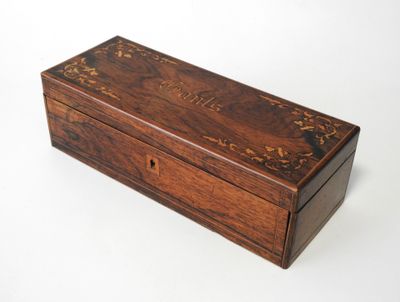 an old wooden box sitting on top of a white surface