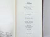 someone is holding a book open to a page with a list on it