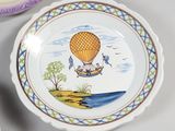 a plate with a picture of a hot air balloon on it and a plate with a picture of a hot air balloon on it