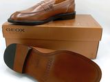 men ' s brown dress shoes are on top of a box