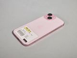 a pink cell phone with a sticker on it