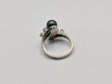 sterling silver ring with a green pearl and a diamond