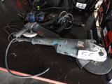 a picture of a corded sander and other tools on a table