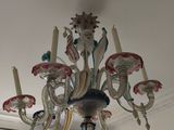 a chandelier that is hanging from the ceiling in the room