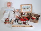 a lot of dolls that are sitting on a table