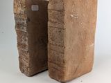 two pieces of wood are stacked on top of each other