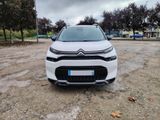 a white citrole is parked in a parking lot