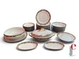 a lot of plates and bowls sitting on a table